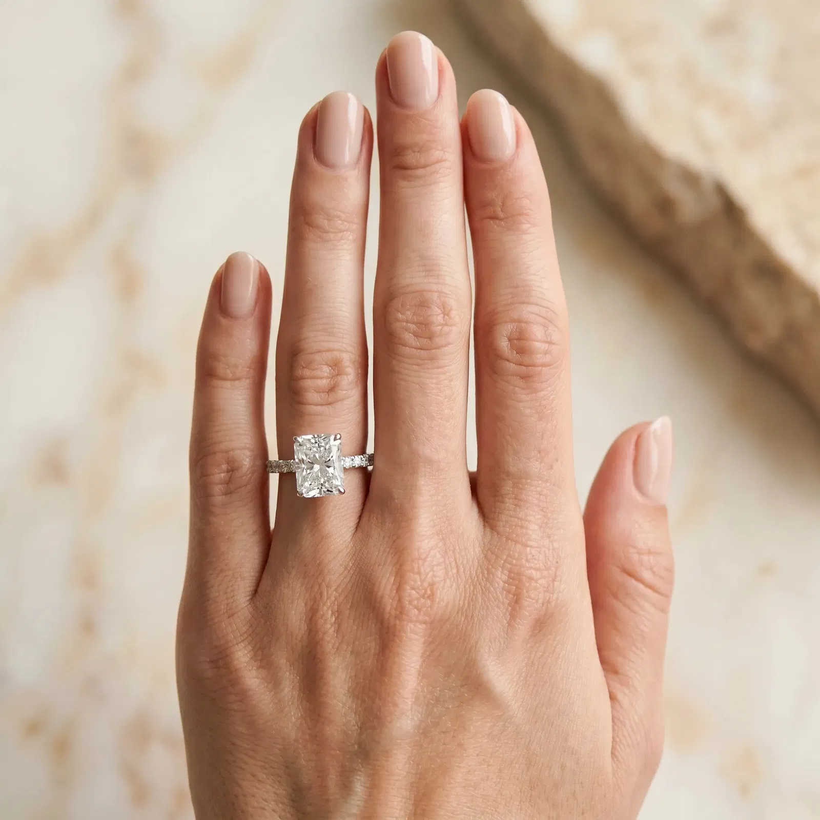 Radiant Cut Diamond Solitaire Ring with Round Pavé Band and Four-Prong Setting Platinum