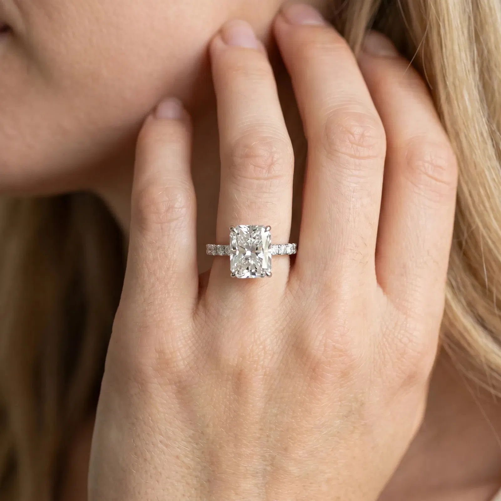 Radiant Cut Diamond Solitaire Ring with Round Pavé Band and Four-Prong Setting Platinum